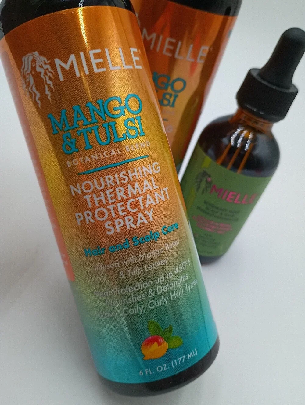 Mielle Haircare Scalp & Hair Strengthening Oil And Thermal Protectant Spray.